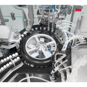 Rotary filling and closing machines for vials